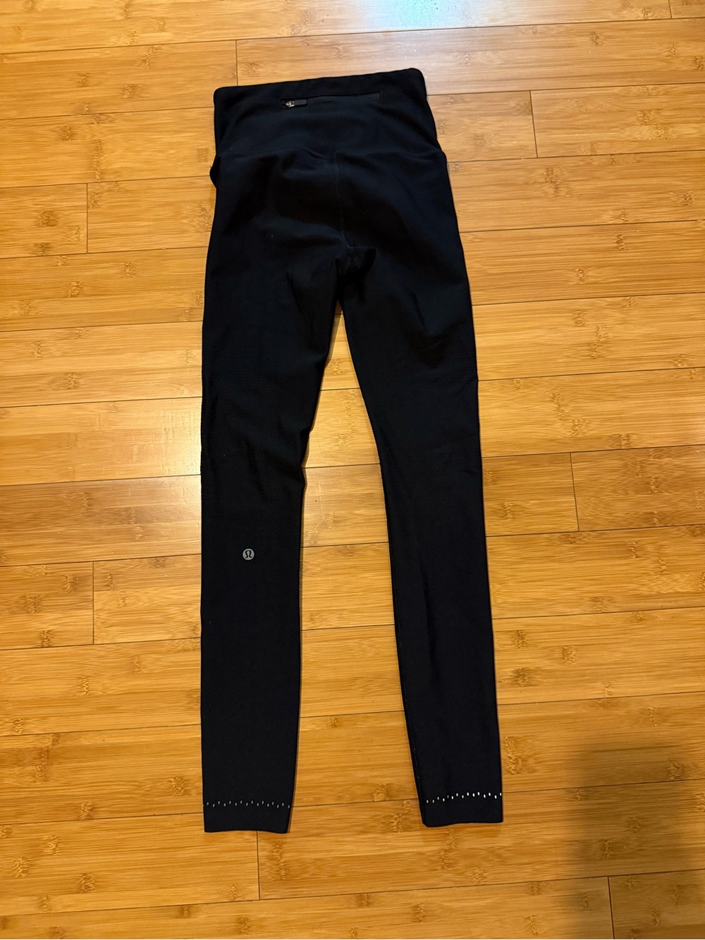 Lululemon Black High-Waist Full-Length Leggings with small holes along hem - Picture 2 of 3